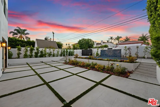 a living room with couch and a floor to ceiling window