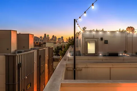 a view of a balcony with city view
