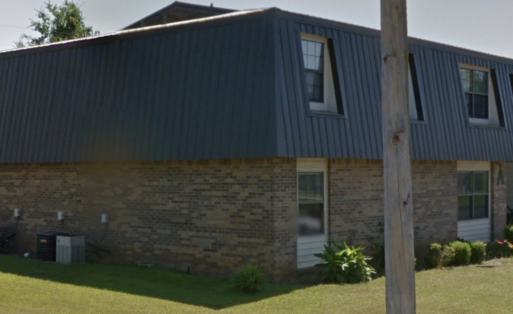 401 Dogwood Drive Other, AL 36344 - Photo 2 of 6 a brick building with a black door