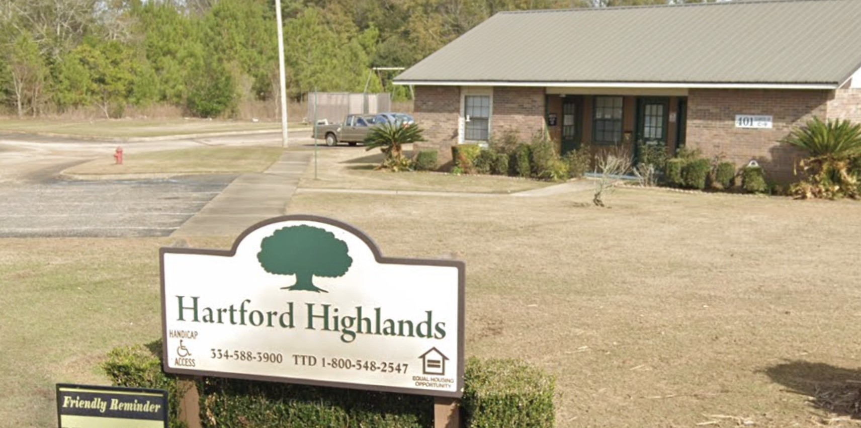 401 Dogwood Drive Other, AL 36344 - Photo 5 of 6 a front view of a building with garden and retail shops