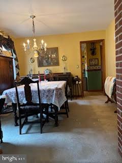 210 Brownbacks Church Road Spring City, PA 19475 - Photo 3 of 5 a bedroom with furniture and a chandelier