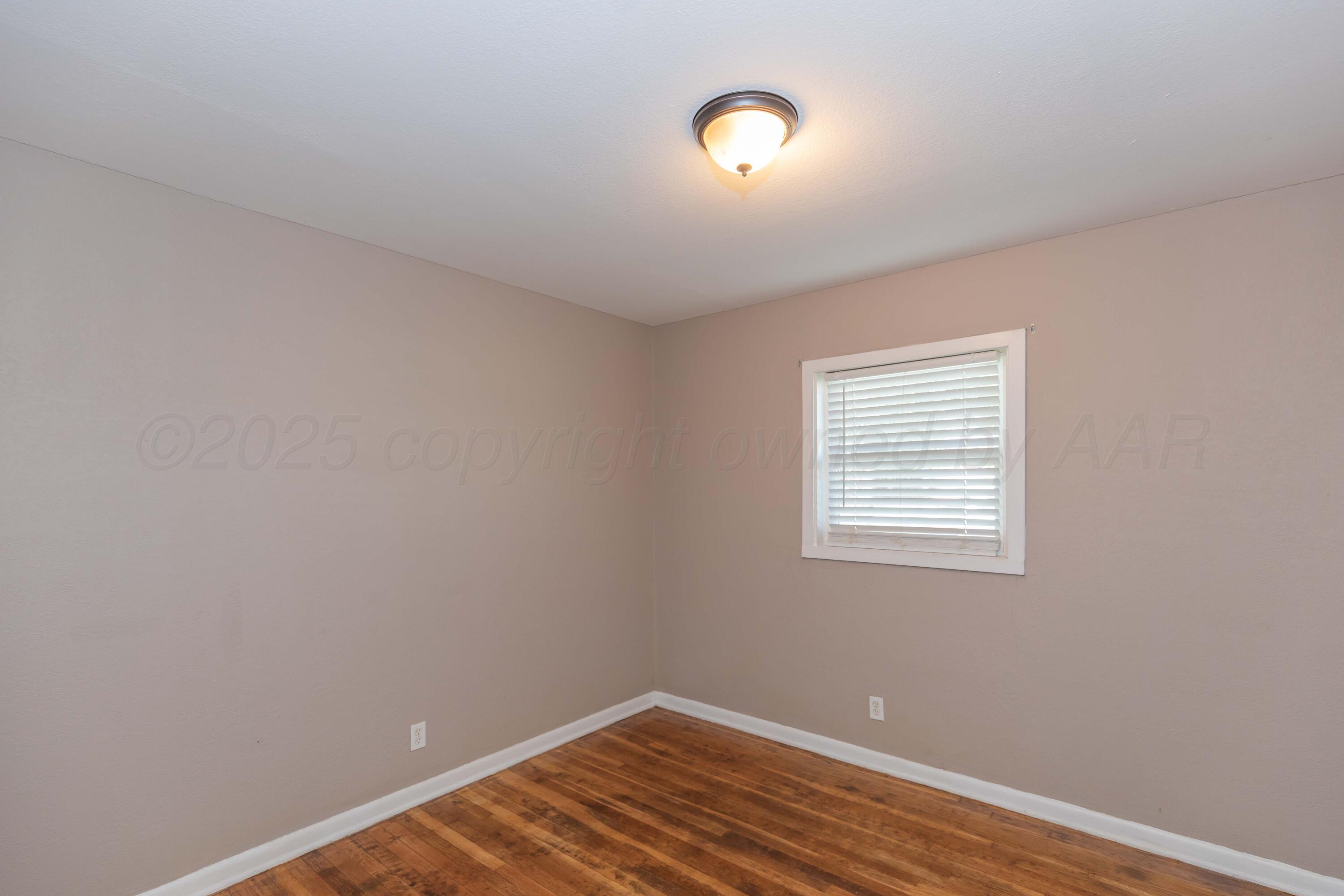 2138 North Sumner Street Pampa, TX 79065 - Photo 14 of 30 an empty room with a workspace