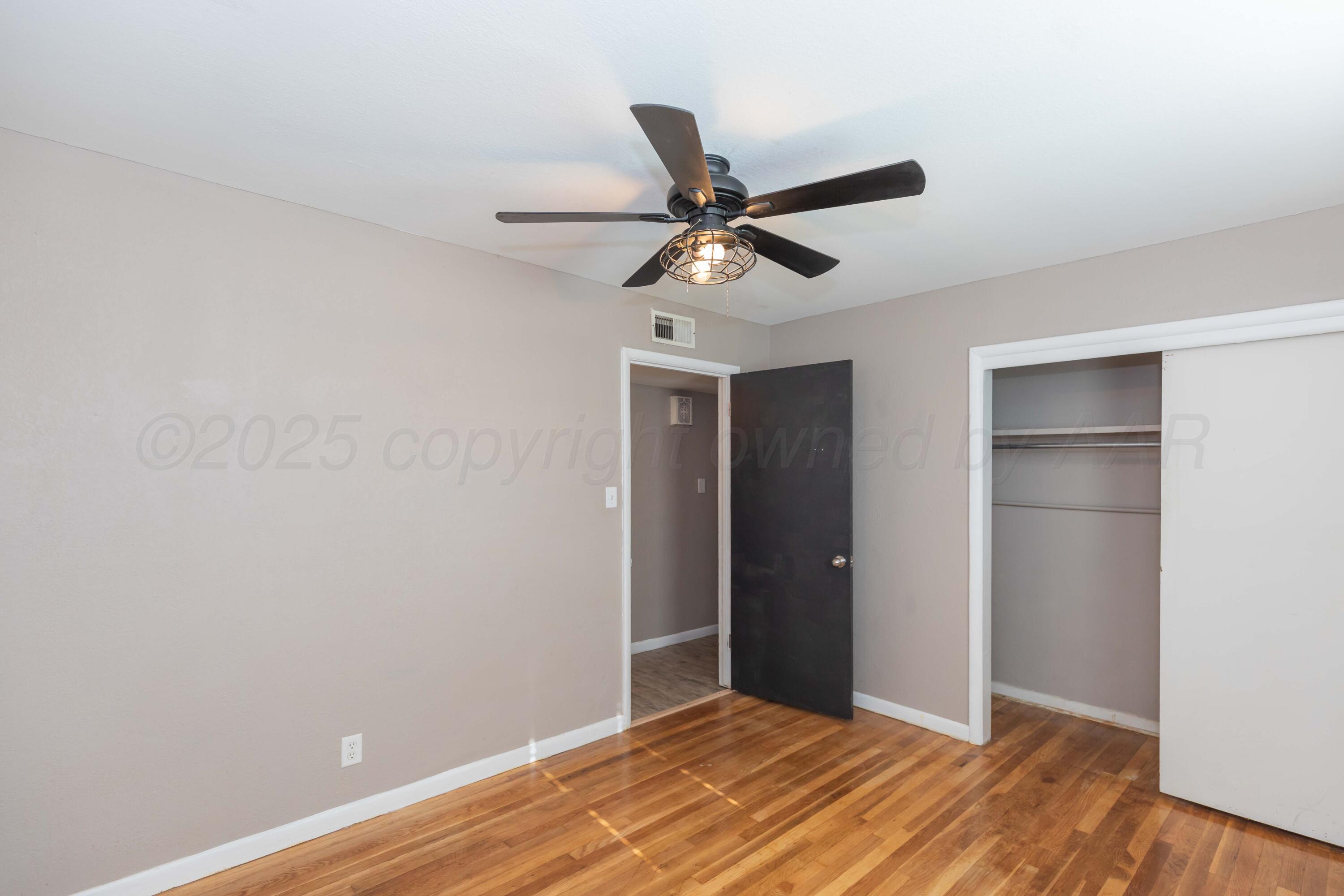 2138 North Sumner Street Pampa, TX 79065 - Photo 22 of 30 a view of empty room with wooden floor