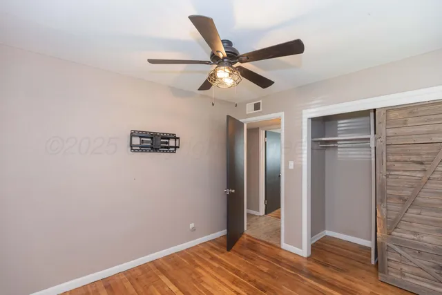 a view of a livingroom with wooden floor