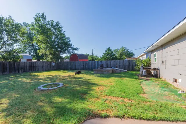 a swimming pool with wooden fence
