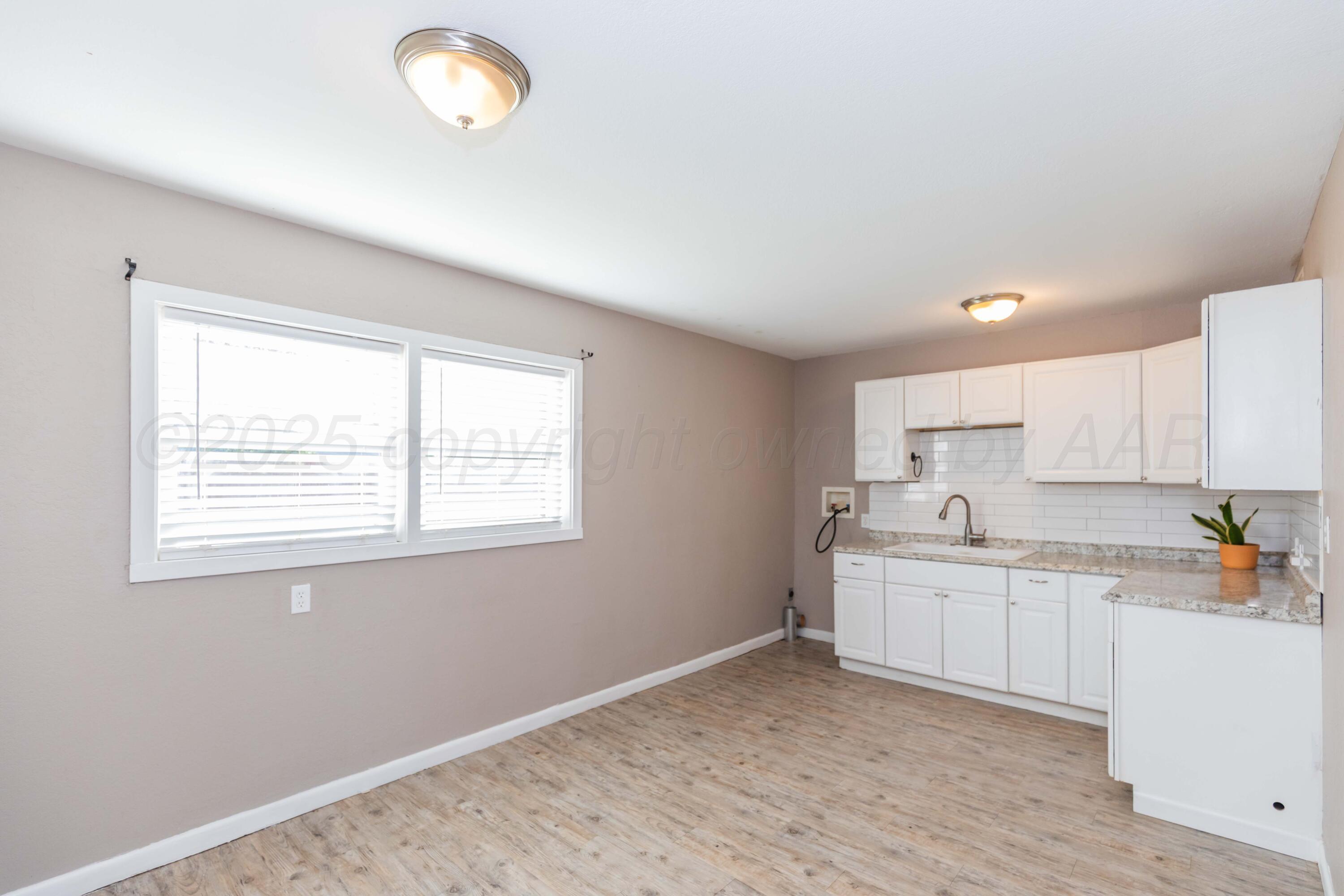 2138 North Sumner Street Pampa, TX 79065 - Photo 9 of 30 a view of a kitchen with a window