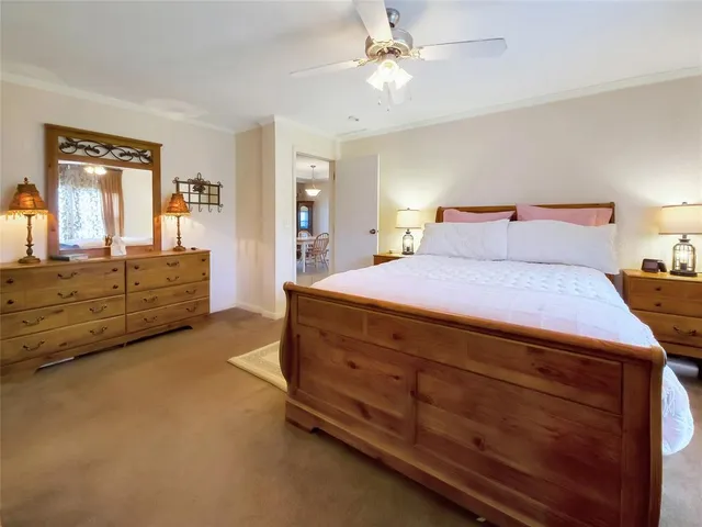 a room with a bed and dresser