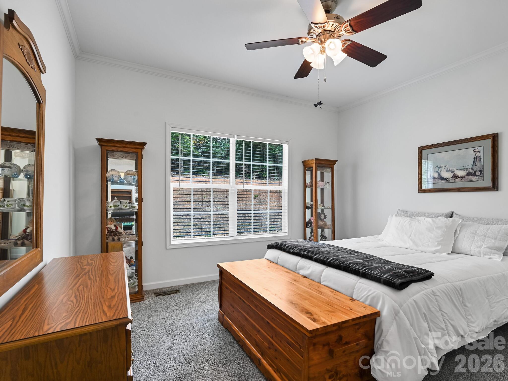 241 West Sunset Ridge Drive Etowah, NC 28729 - Photo 23 of 30 a bedroom with bed and window