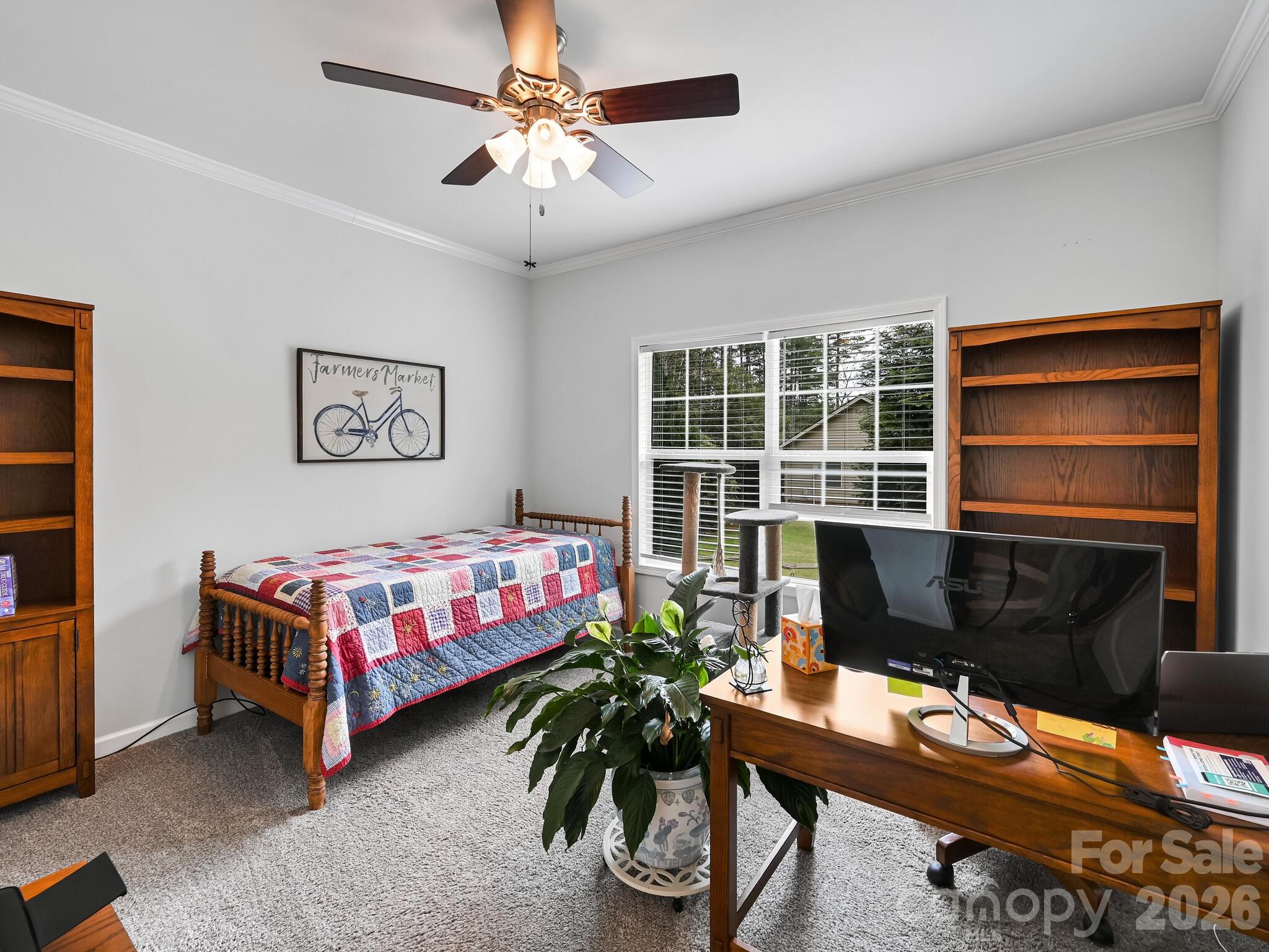 241 West Sunset Ridge Drive Etowah, NC 28729 - Photo 25 of 30 a bedroom with a bed and a window