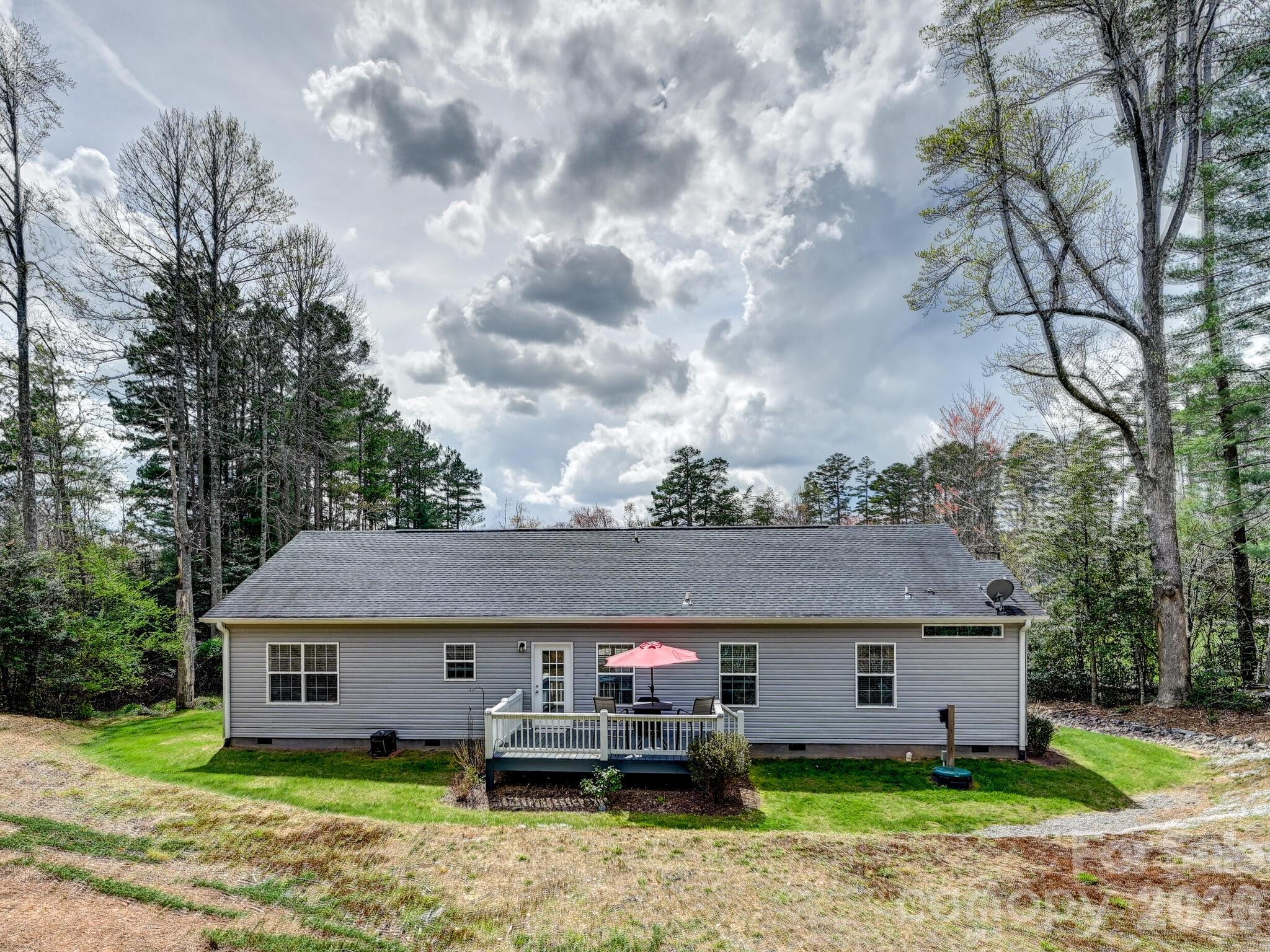 241 West Sunset Ridge Drive Etowah, NC 28729 - Photo 27 of 30 a front view of a house with garden