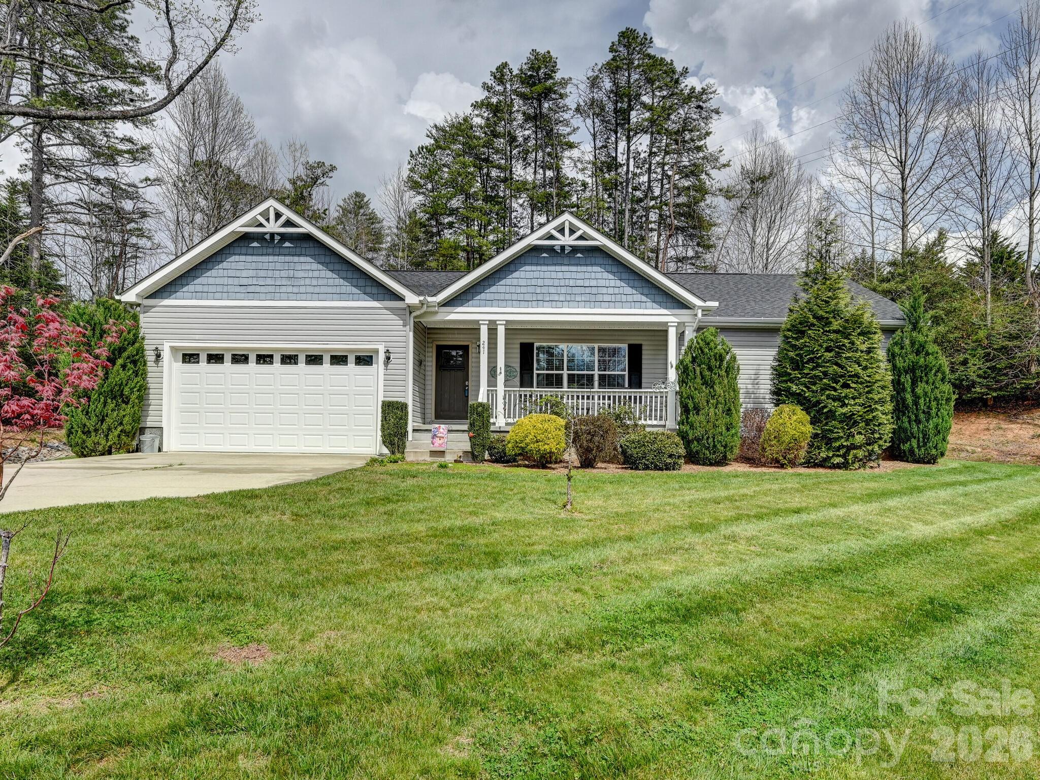 241 West Sunset Ridge Drive Etowah, NC 28729 - Photo 3 of 30 a front view of a house with a yard