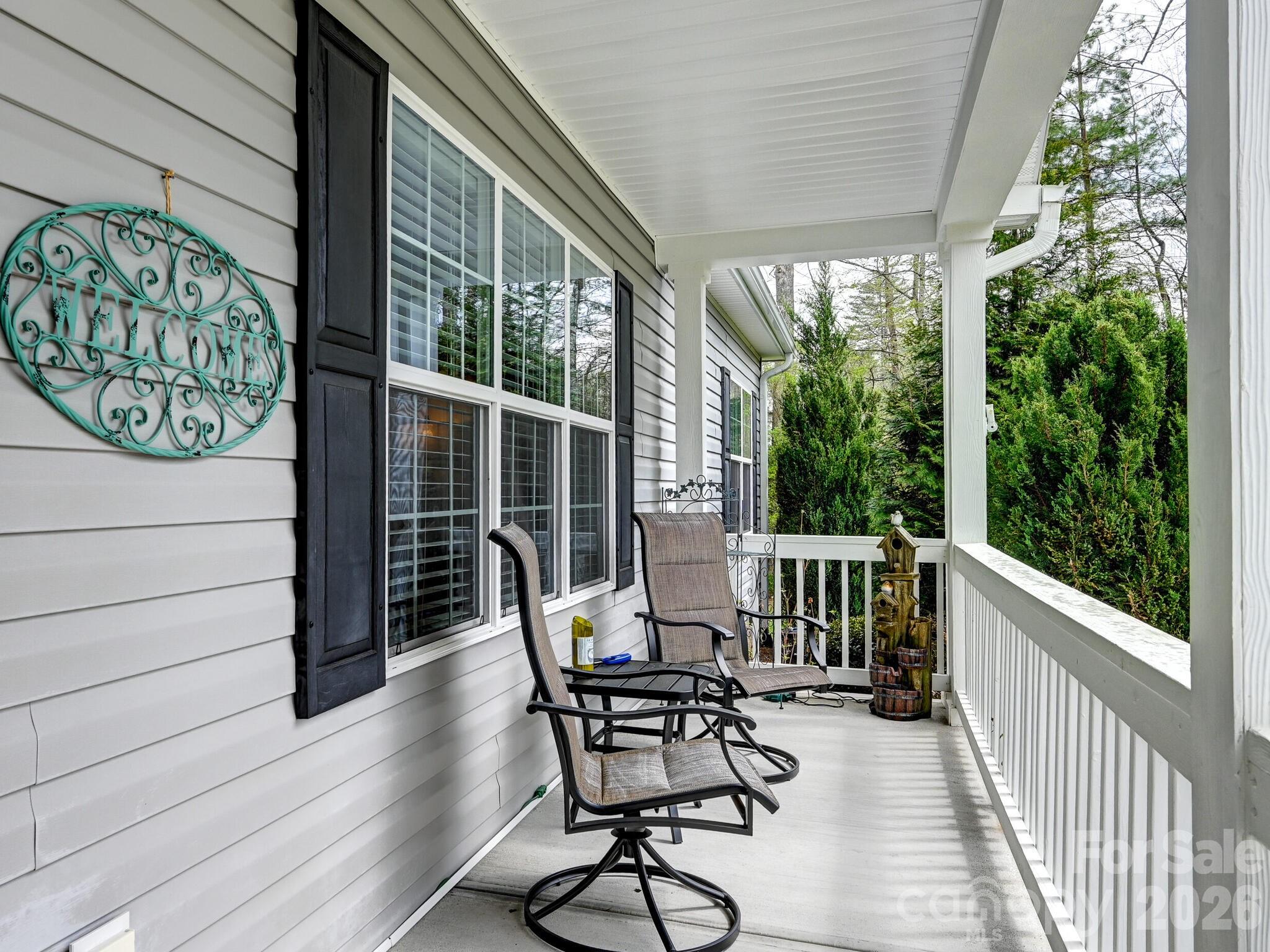 241 West Sunset Ridge Drive Etowah, NC 28729 - Photo 4 of 30 a view of a chair and table in the balcony