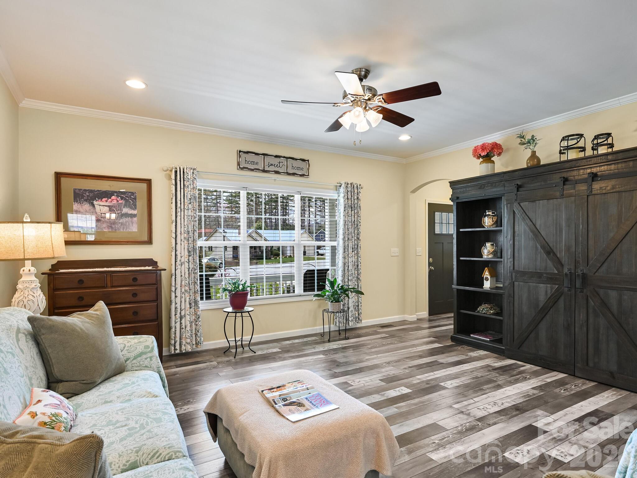 241 West Sunset Ridge Drive Etowah, NC 28729 - Photo 5 of 30 a bedroom with a bed and wooden floor