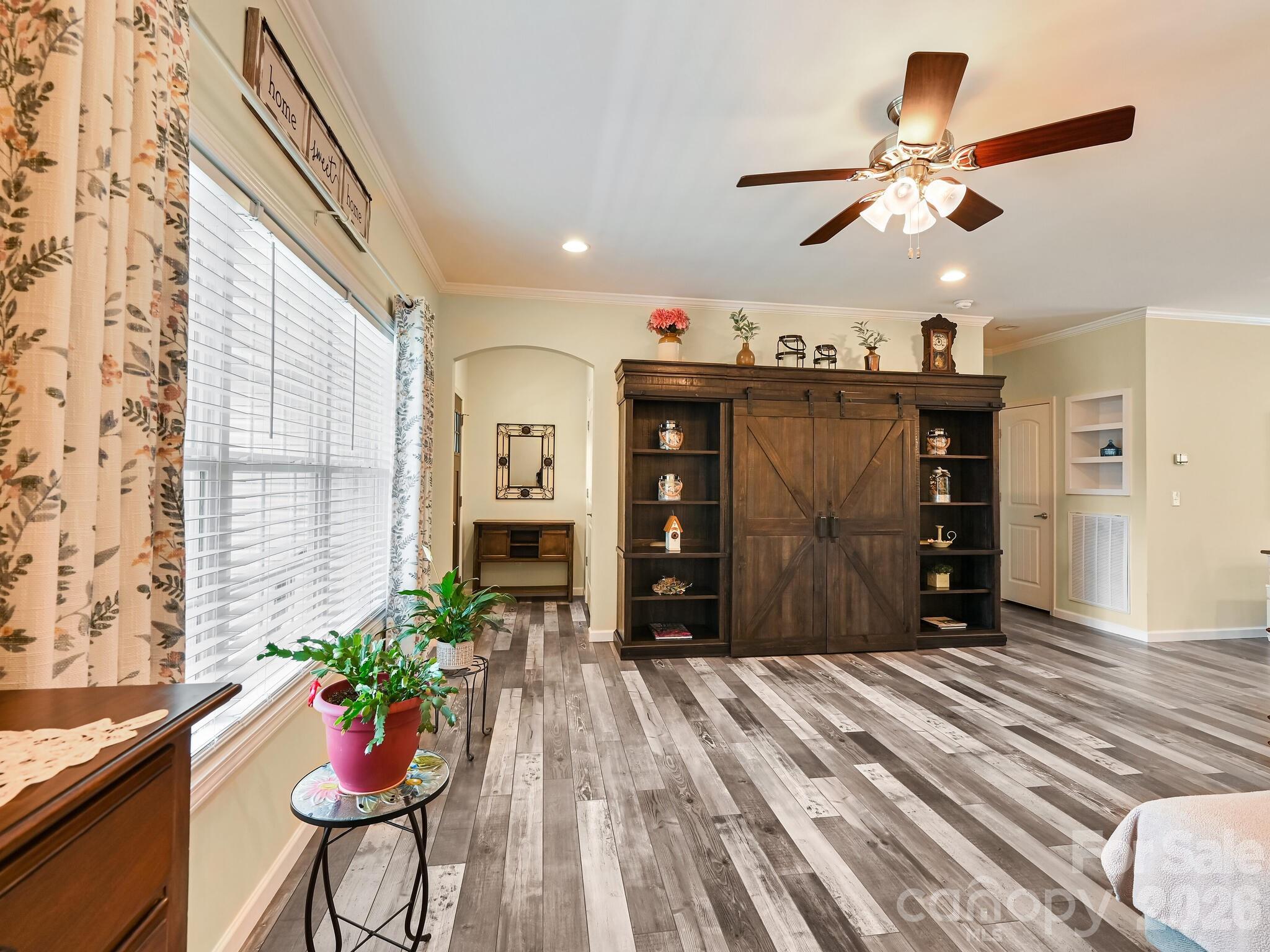 241 West Sunset Ridge Drive Etowah, NC 28729 - Photo 7 of 30 a room with furniture and flowers