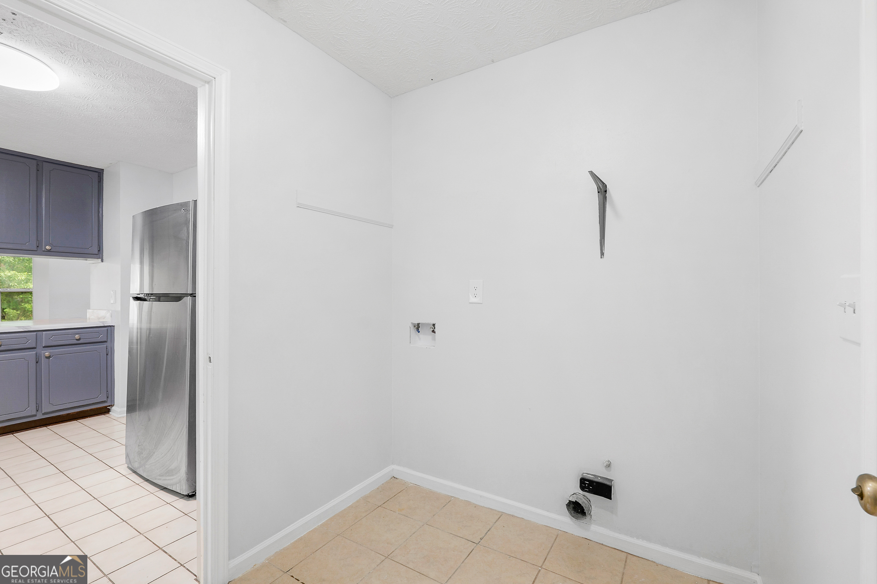1328 Foxvale Drive Hampton, GA 30228 - Photo 6 of 27 a view of a storage & utility room with a sink