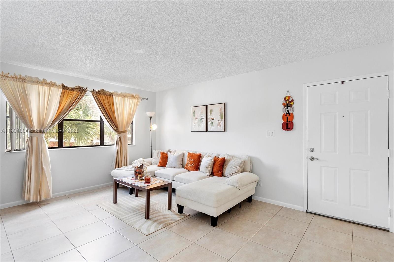 510 South Park Road, Unit 2510 Hollywood, FL 33021 - Photo 2 of 14 a living room with furniture and a window