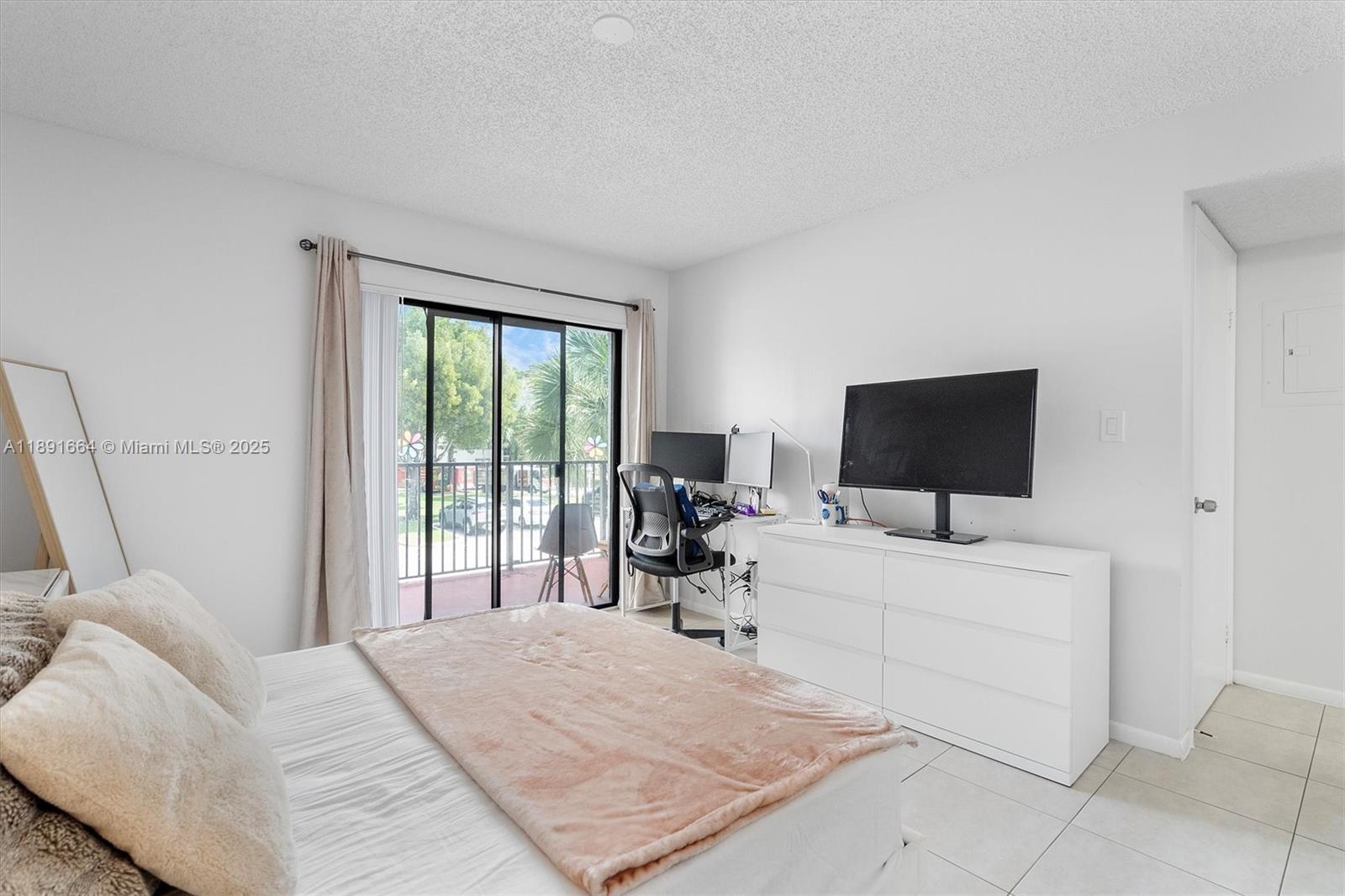 510 South Park Road, Unit 2510 Hollywood, FL 33021 - Photo 10 of 14 a bedroom with a bed and a flat screen tv