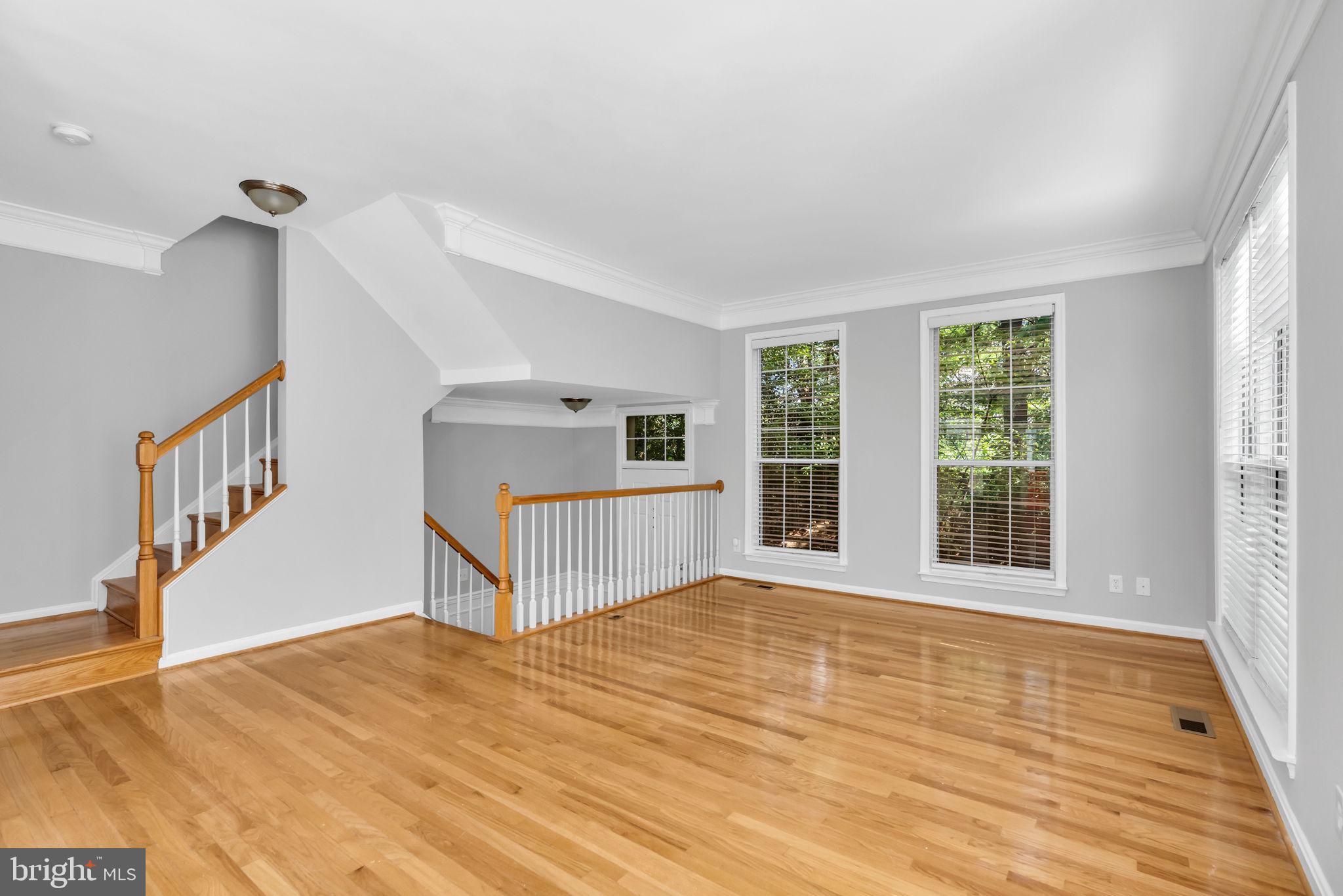 6013 Riddle Walk Alexandria, VA 22312 - Photo 7 of 31 a view of a room with wooden floor and stairs