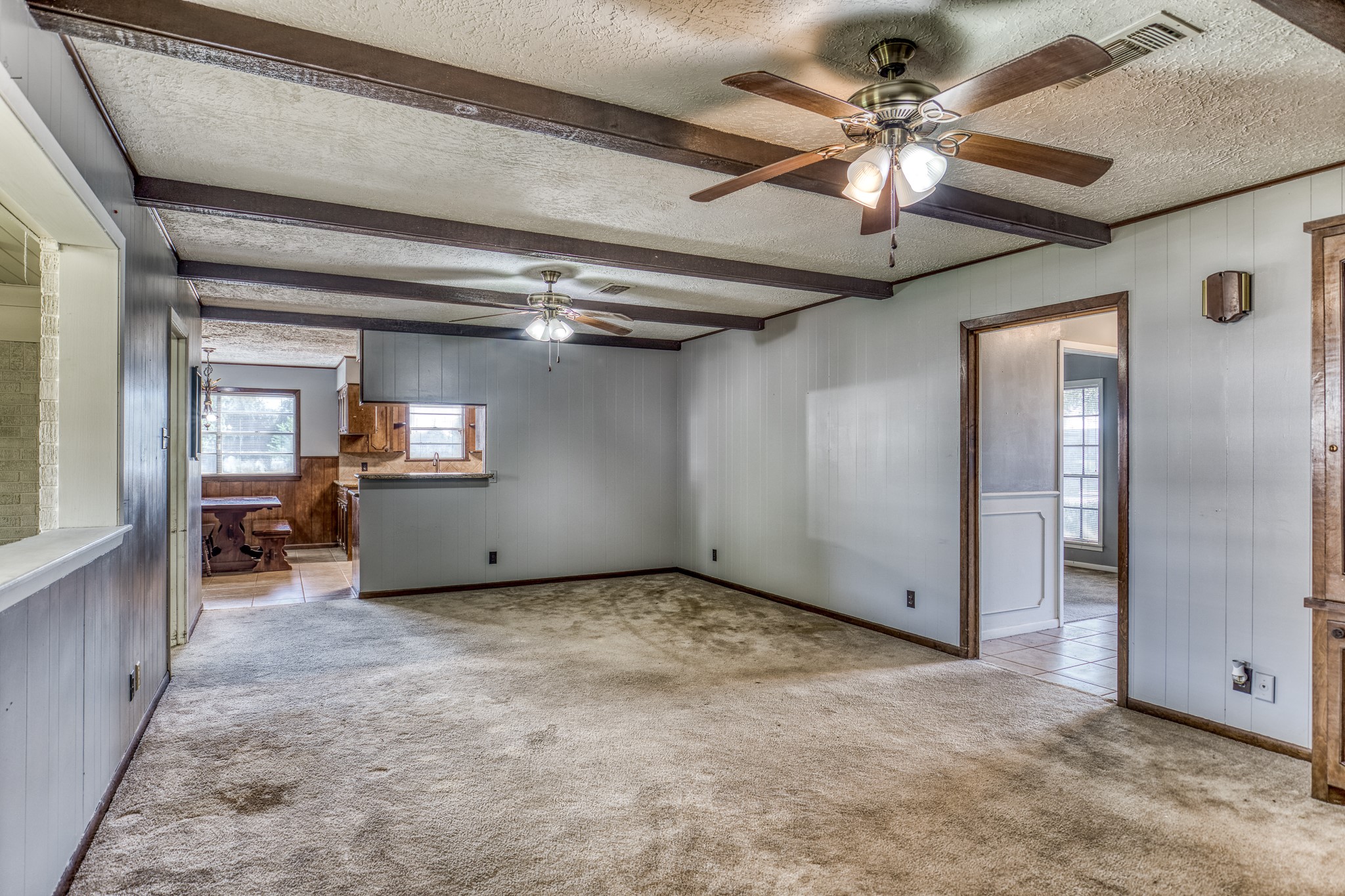 1687 Eagle Lake Road Sealy, TX 77474 - Photo 15 of 27 en empty room with windows and ceiling fan