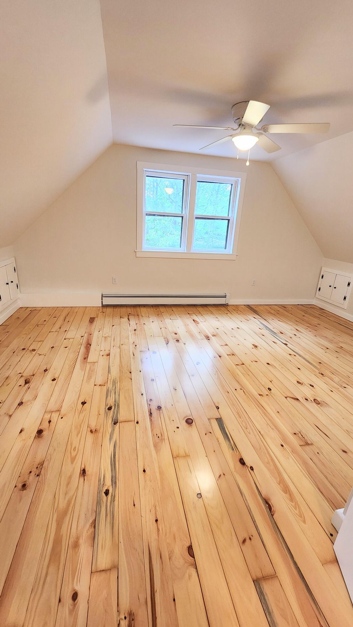 147 Chippingstone Road Marstons Mills, MA 02648 - Photo 11 of 23 a view of wooden floor and windows in a room