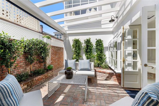 a view of balcony with furniture