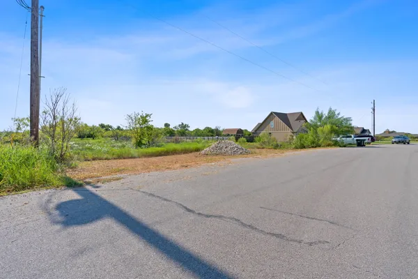 a view of a road and a building in the background
