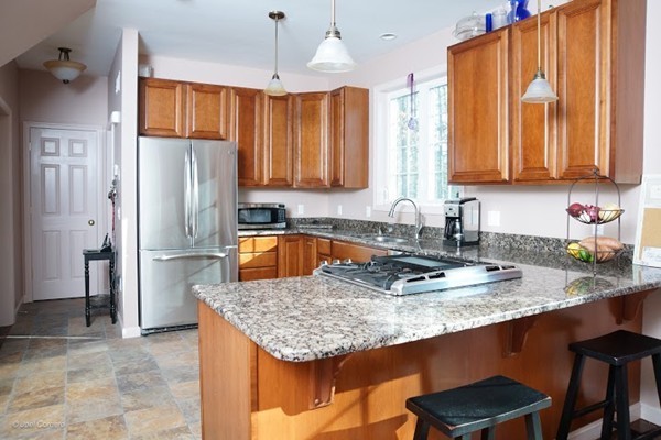 88 Fearing Hill Road Wareham, MA 02576 - Photo 2 of 29 a kitchen with granite countertop a sink stainless steel appliances and cabinets