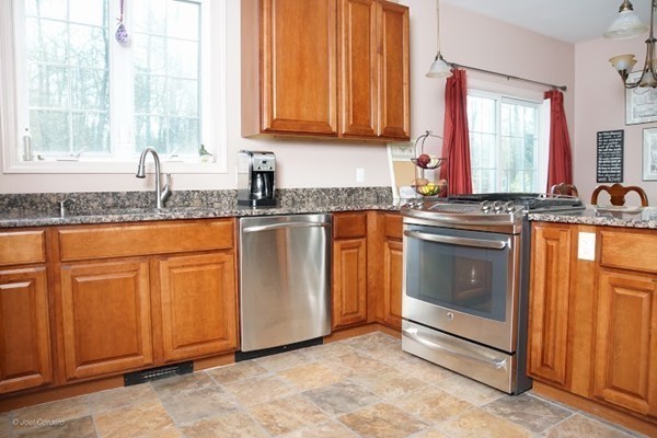 88 Fearing Hill Road Wareham, MA 02576 - Photo 4 of 29 a kitchen with granite countertop cabinets stainless steel appliances a sink and a window