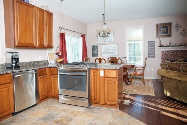 88 Fearing Hill Road Wareham, MA 02576 - Photo 5 of 29 a kitchen with stainless steel appliances granite countertop a stove a sink and a refrigerator