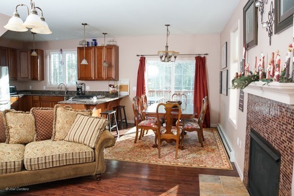 88 Fearing Hill Road Wareham, MA 02576 - Photo 6 of 29 a living room with furniture and a fireplace