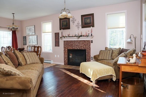 88 Fearing Hill Road Wareham, MA 02576 - Photo 8 of 29 a living room with furniture and a fireplace