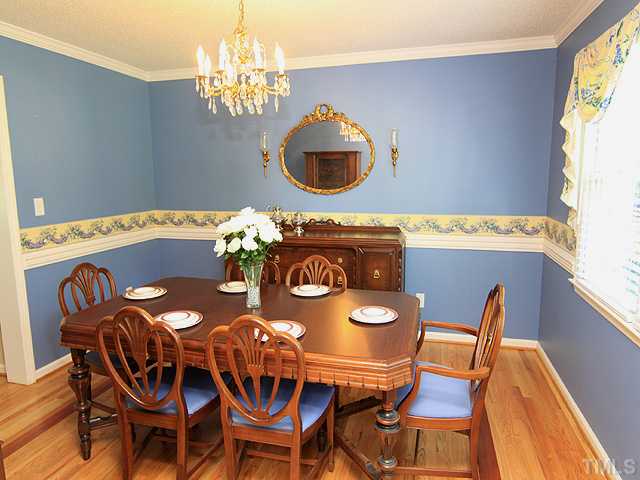 115 Equestrian Chase Rougemont, NC 27572 - Photo 3 of 12 a view of a dining room with furniture and chandelier