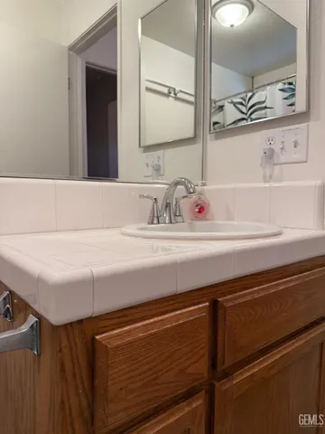 a bathroom with a sink and a mirror