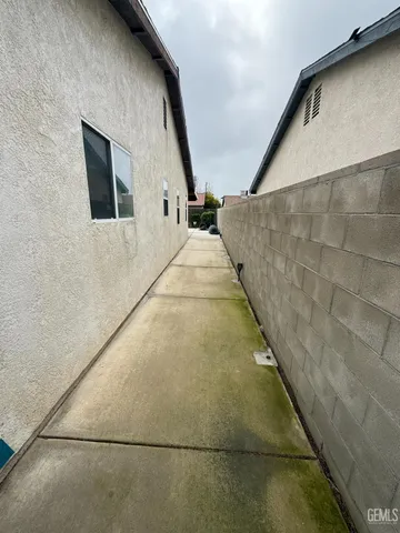a view of a room with wooden floor and windows