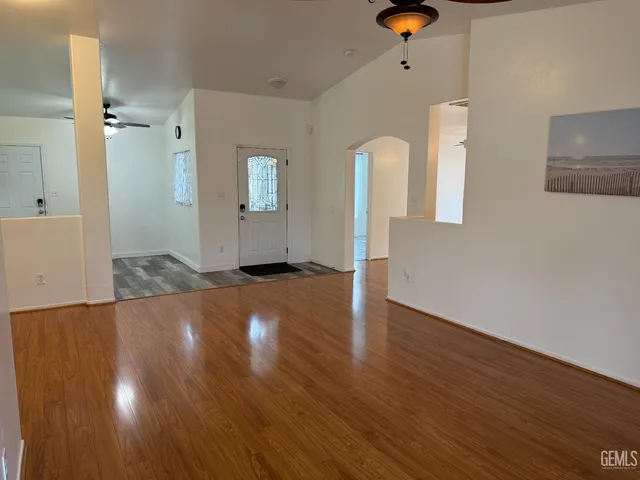 wooden floor in an empty room with a window