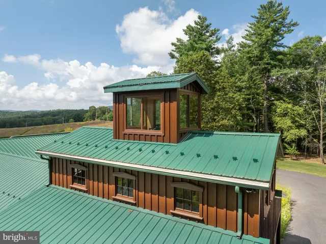 a view of a living room and kitchen with a large window
