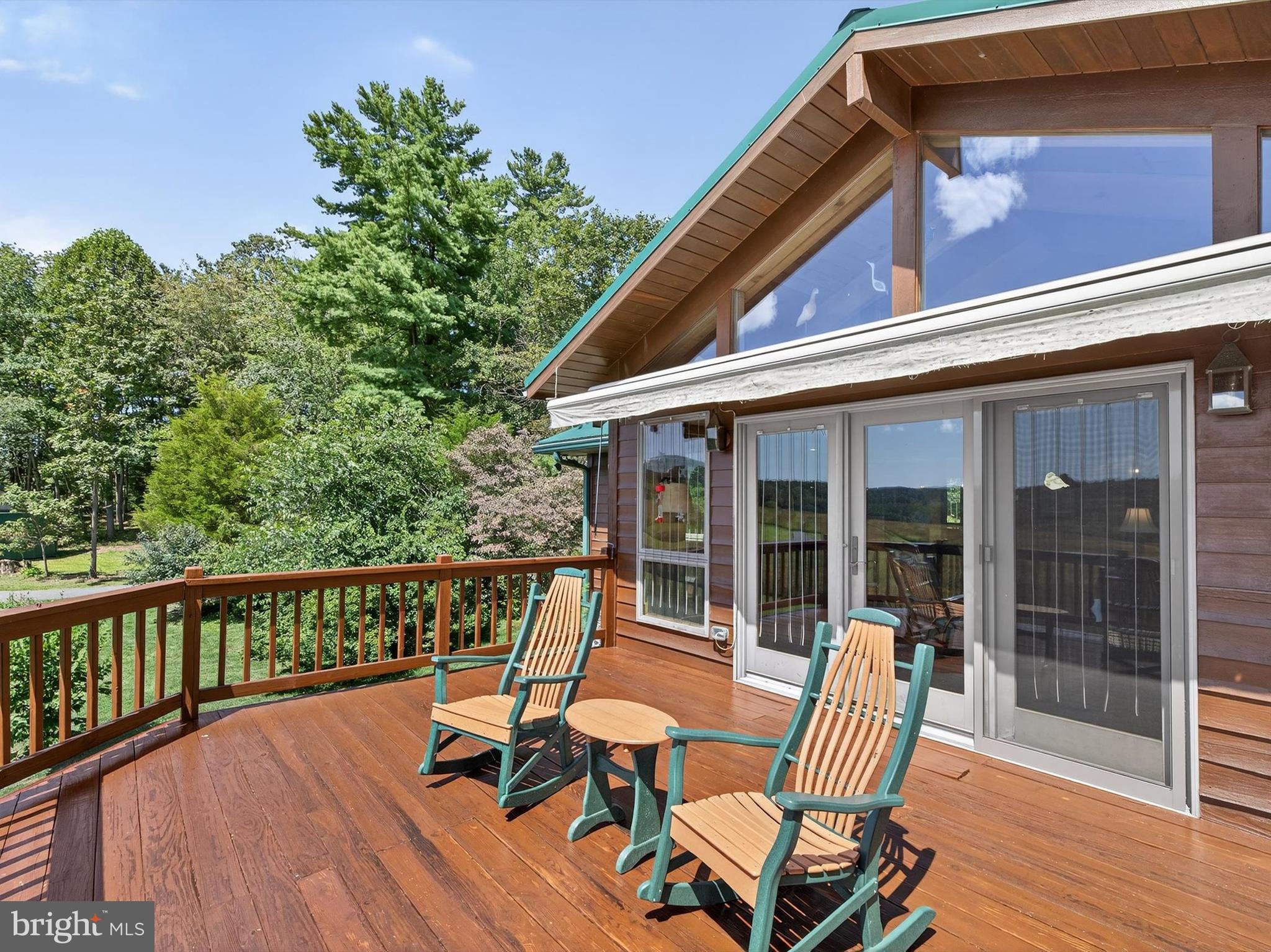 1494 Mountain Road Orrtanna, PA 17353 - Photo 35 of 80 a view of a chair and table on the wooden deck