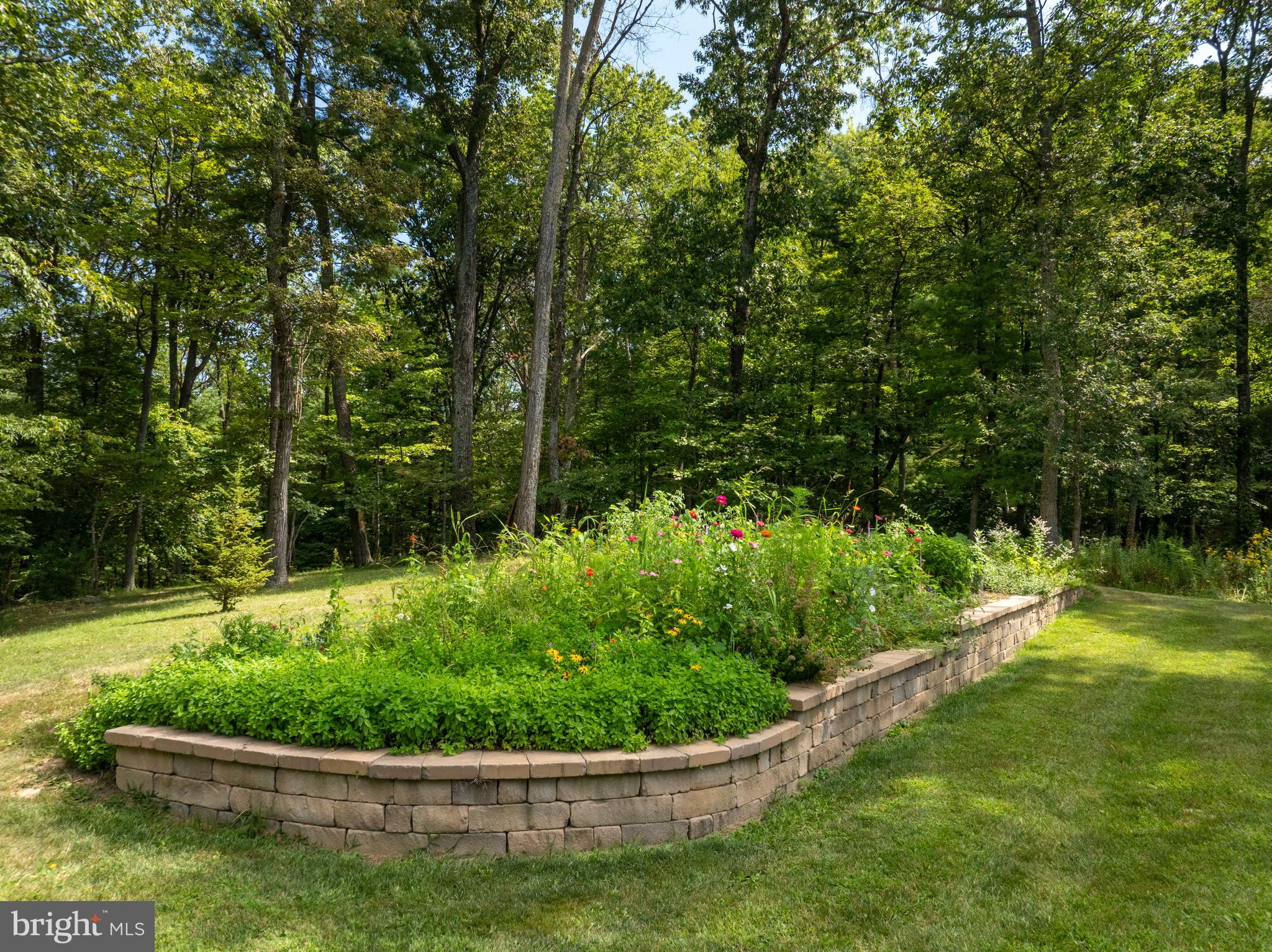 1494 Mountain Road Orrtanna, PA 17353 - Photo 66 of 80 a view of a garden with a fountain
