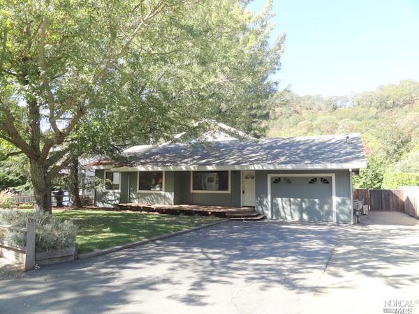 105 Riddle Road Glen Ellen, CA 95442 - Photo 1 of 1 a front view of a house with garden