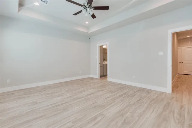 a bathroom with a bathtub a sink a vanity and a shower