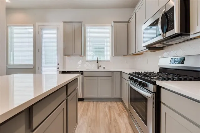 a kitchen with sink and window