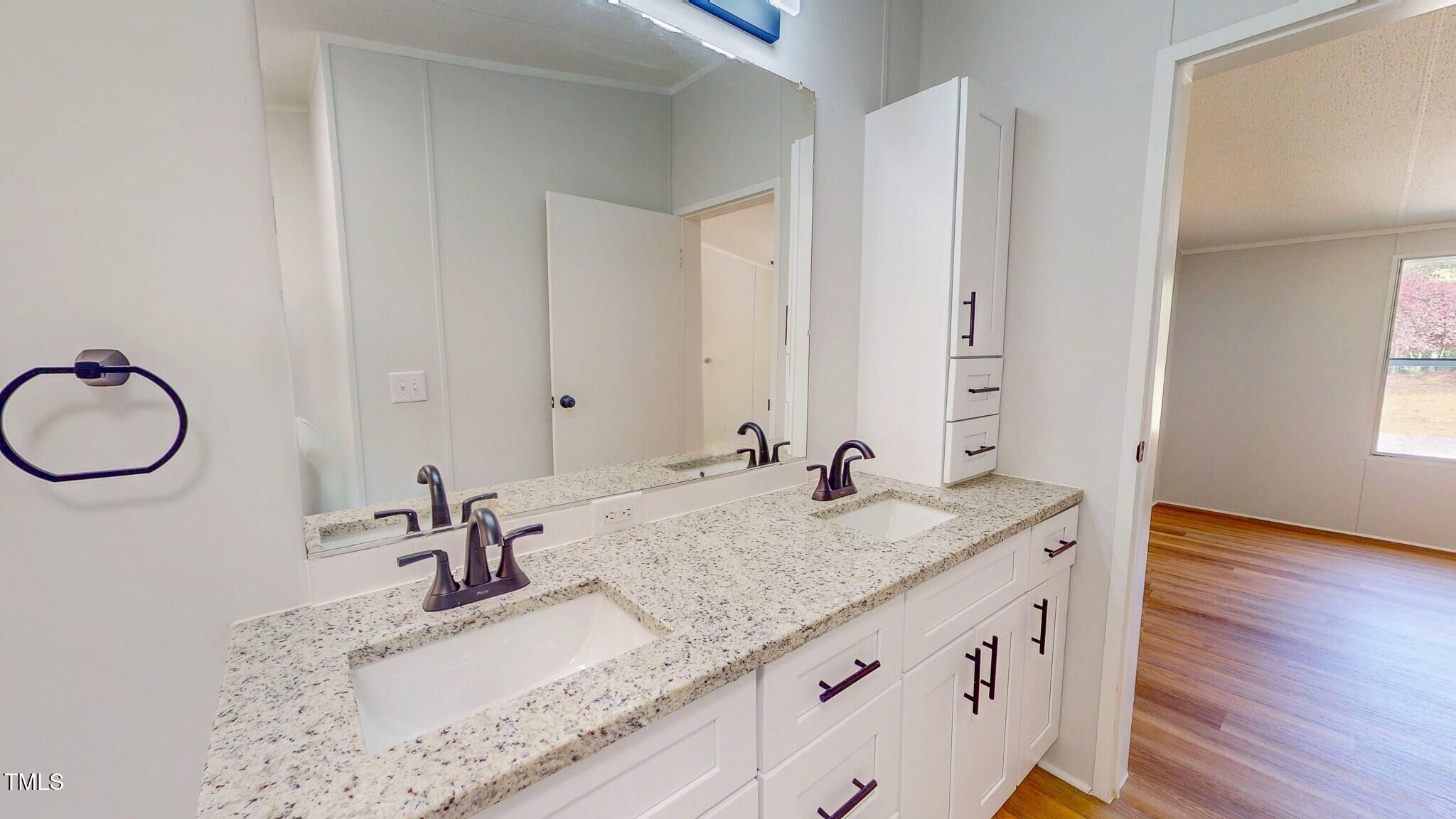 1622 Julian Oakley Road Rougemont, NC 27572 - Photo 13 of 30 a bathroom with a granite countertop sink and a mirror
