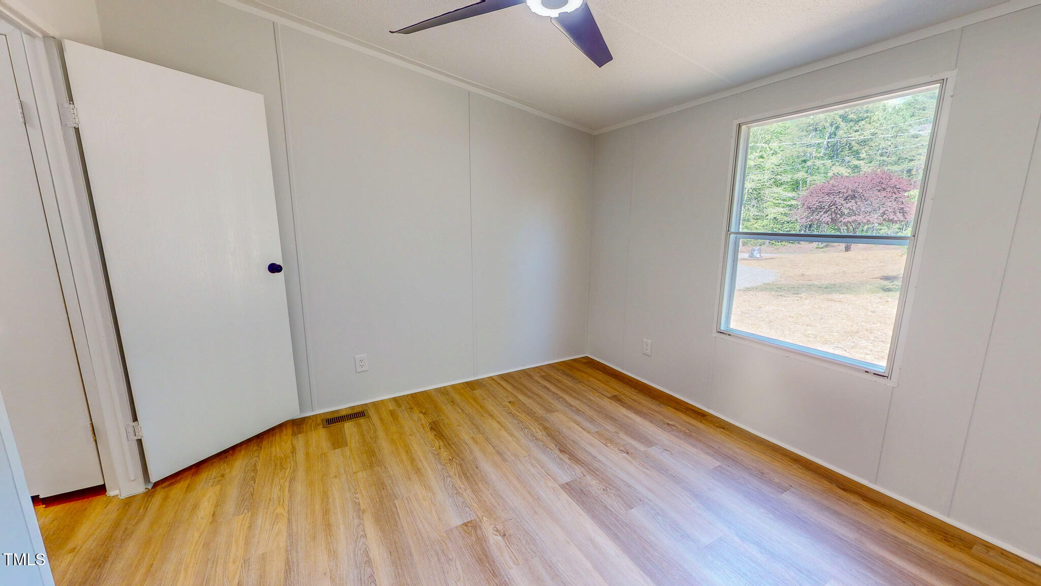 1622 Julian Oakley Road Rougemont, NC 27572 - Photo 20 of 30 a view of empty room with wooden floor and fan