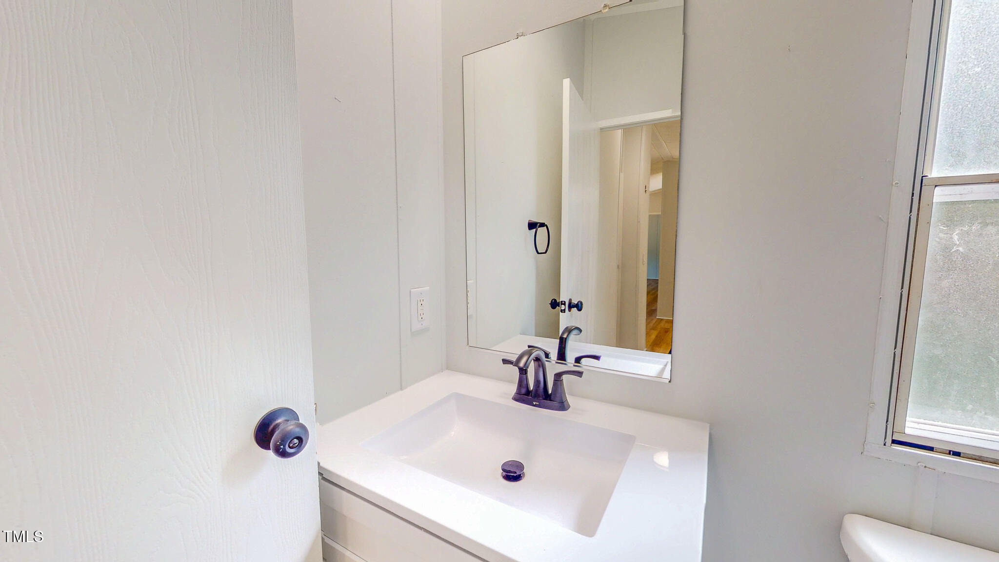1622 Julian Oakley Road Rougemont, NC 27572 - Photo 21 of 30 a bathroom with a sink and a mirror