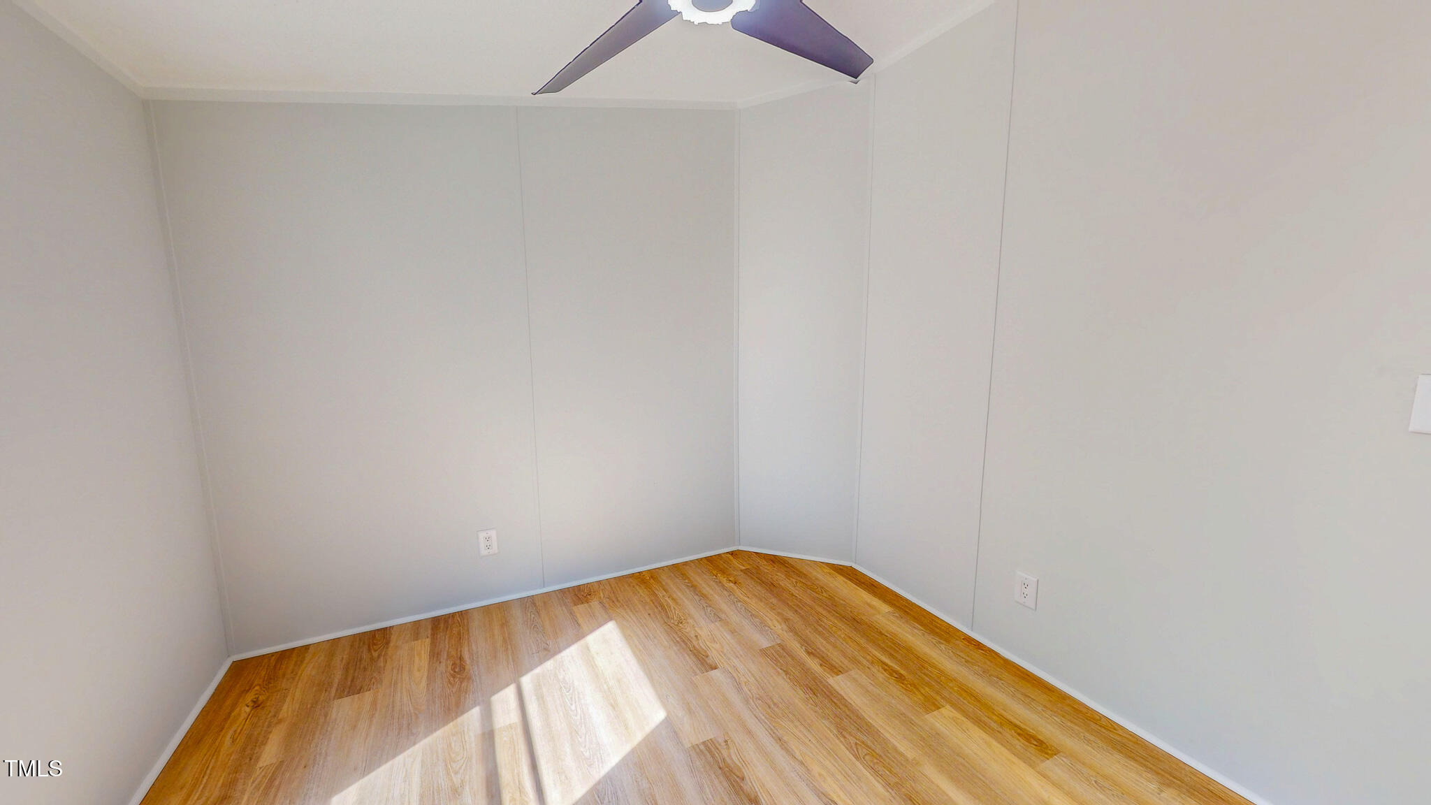 1622 Julian Oakley Road Rougemont, NC 27572 - Photo 23 of 30 a view of a room with wooden floor and a ceiling fan