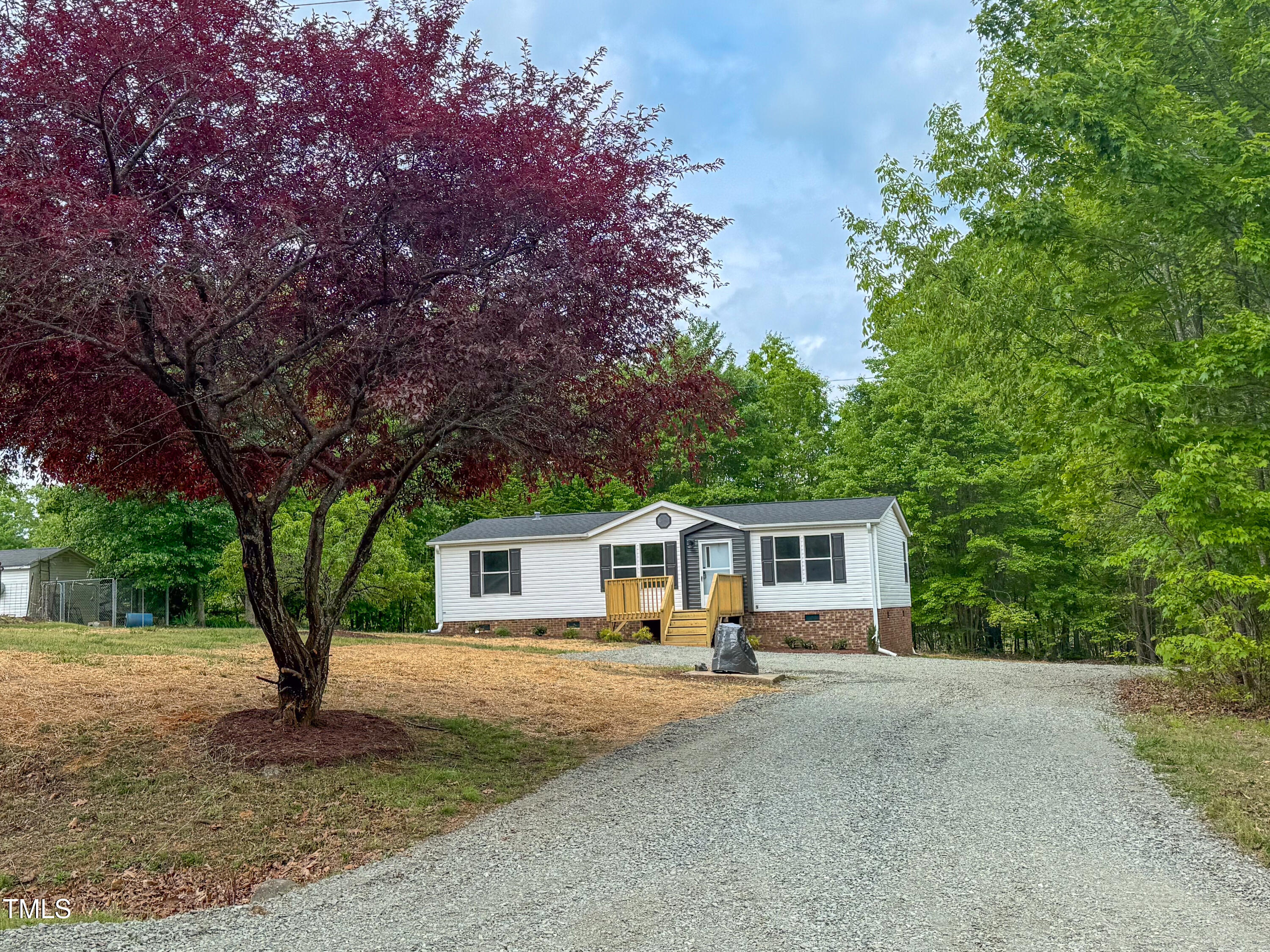 1622 Julian Oakley Road Rougemont, NC 27572 - Photo 30 of 30 a front view of a house with a garden