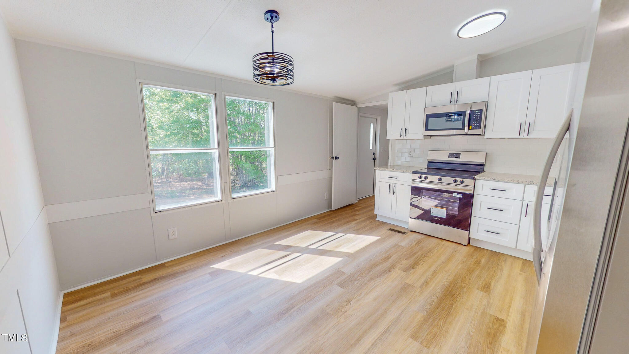 1622 Julian Oakley Road Rougemont, NC 27572 - Photo 3 of 30 a view of empty room with kitchen and window