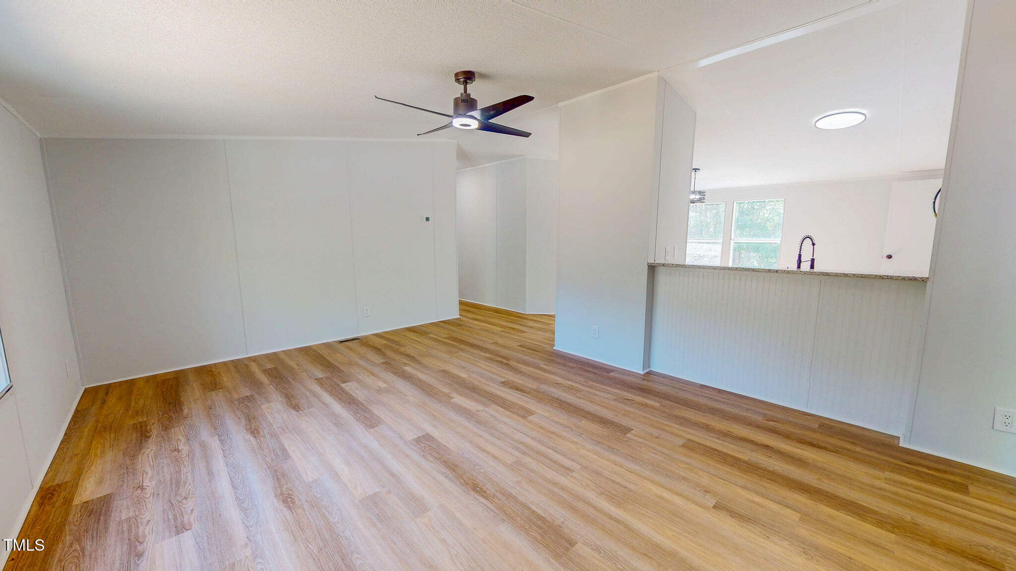 1622 Julian Oakley Road Rougemont, NC 27572 - Photo 4 of 30 a view of a room with wooden floor and ceiling fan