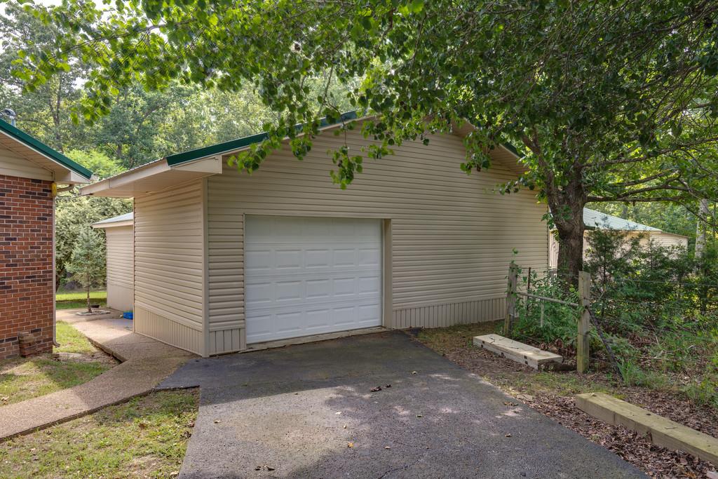 200 Coble Road Hohenwald, TN 38462 - Photo 22 of 29 a view of a house with a yard