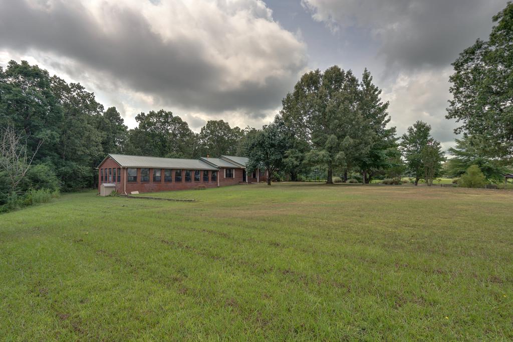 200 Coble Road Hohenwald, TN 38462 - Photo 4 of 29 a view of a house with a garden